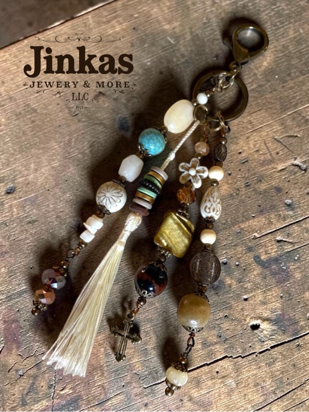 Purse/ Bag charm - rich bronze  and stone with cross charm & tassel